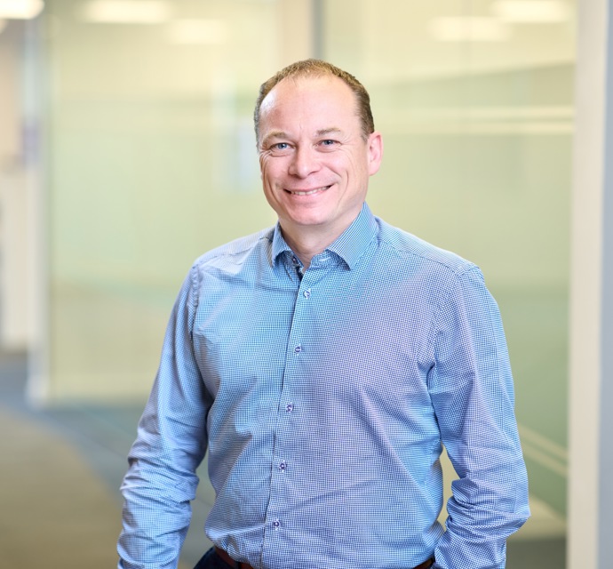 Head and shoulders photograph of a Bromford colleague in an office