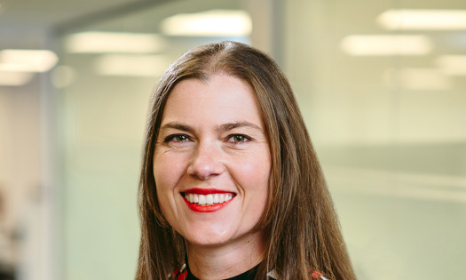 Head and shoulders photograph of a Bromford colleague in an office