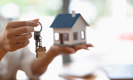 a small model house and keys