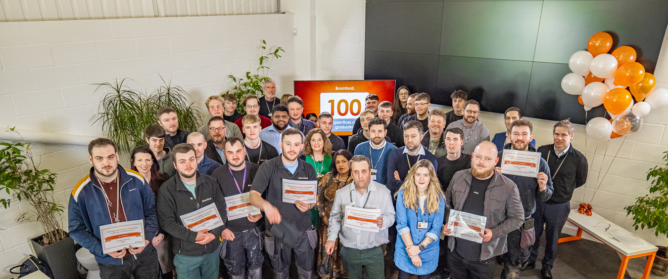 Bromford colleagues holding award certificates 