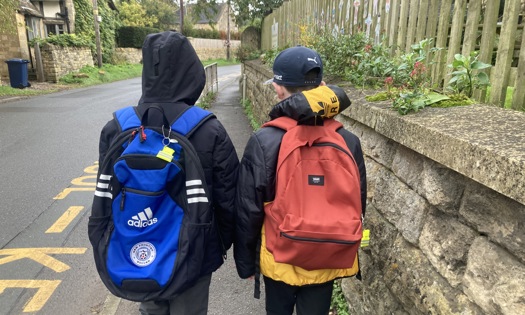 Two Children Walking To School