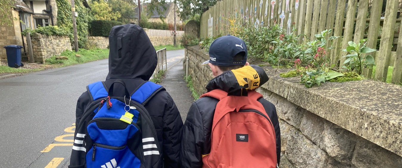 Two Children Walking To School