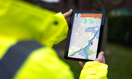 Image of a Bromford colleague using the Bromford Flood Insight app