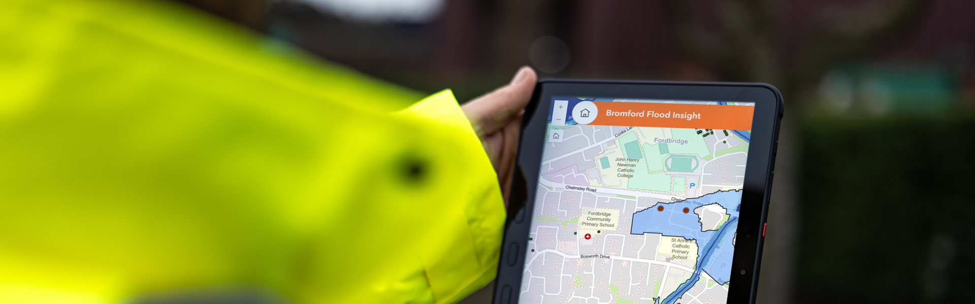 Image of a Bromford colleague using the Bromford Flood Insight app
