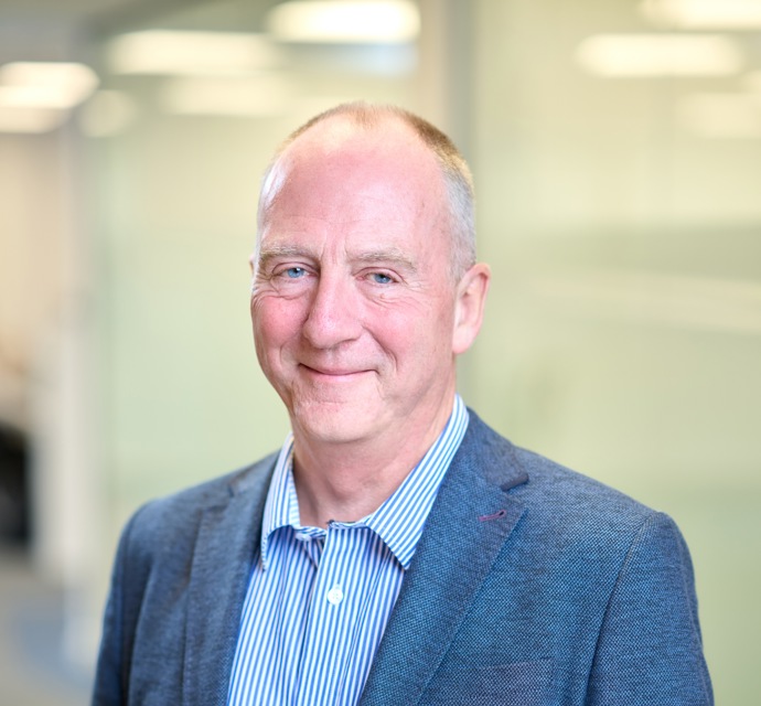 Head and shoulders photograph of a Bromford board member in an office