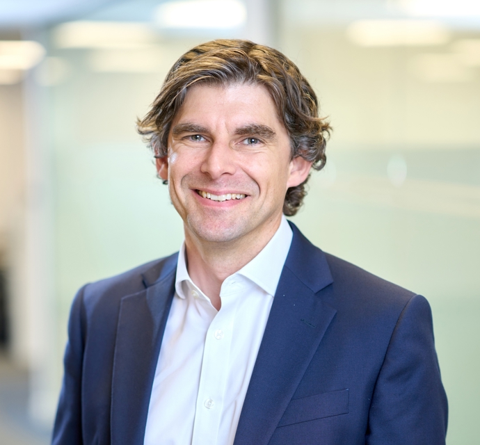 Head and shoulders photograph of a Bromford colleague in an office