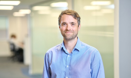 Head and shoulders photograph of a Bromford colleague in an office