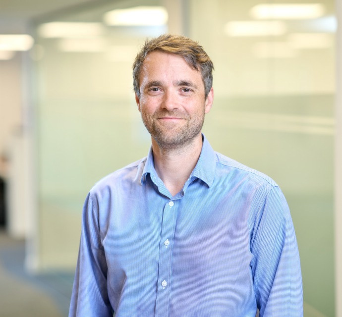 Head and shoulders photograph of a Bromford colleague in an office