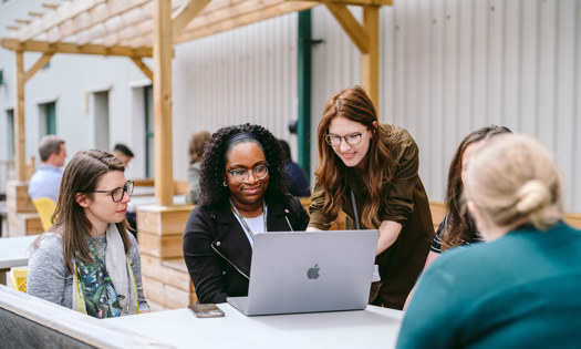 Female Colleagues Around A Table