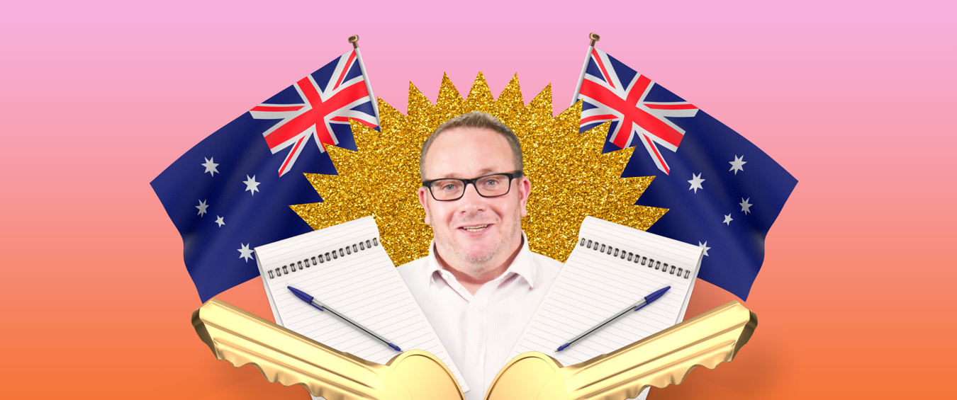 Allan Maund in front of Australian flags 