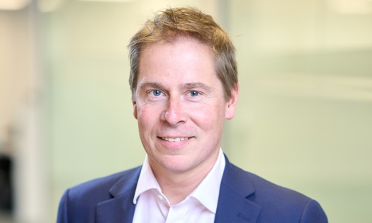 Head and shoulders photograph of a Bromford's chief executive Robert Nettleton in an office