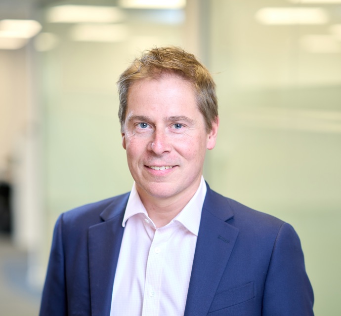 Head and shoulders photograph of a Bromford's chief executive Robert Nettleton in an office