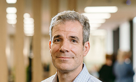 Head and shoulders photograph of a Bromford board member in an office