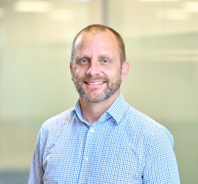 Head and shoulders photograph of a Bromford colleague in an office