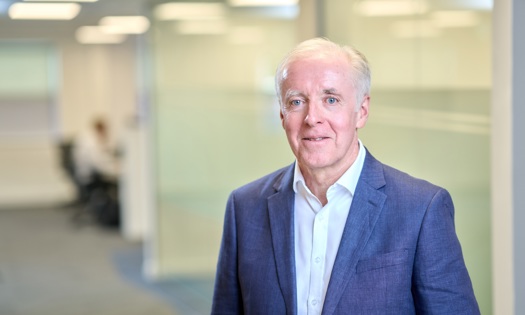 Head and shoulders photograph of a Bromford board member in an office