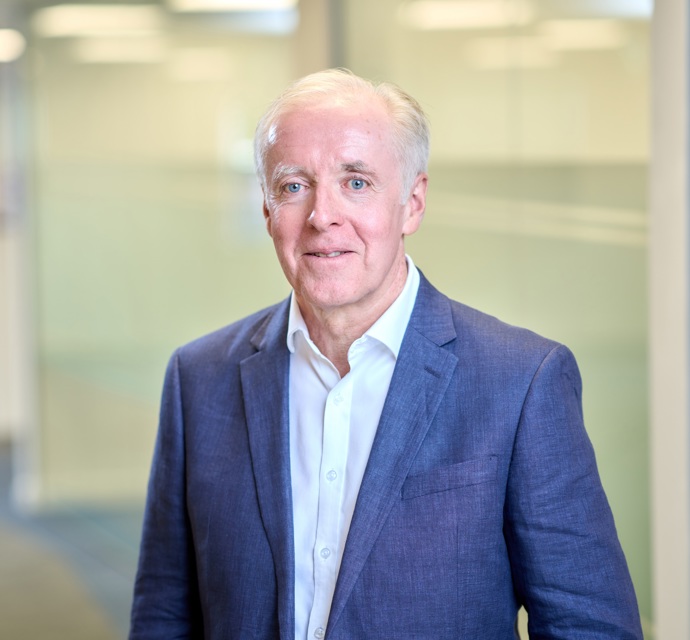 Head and shoulders photograph of a Bromford board member in an office