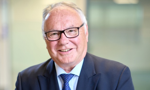 Head and shoulders photograph of a Bromford board member in an office