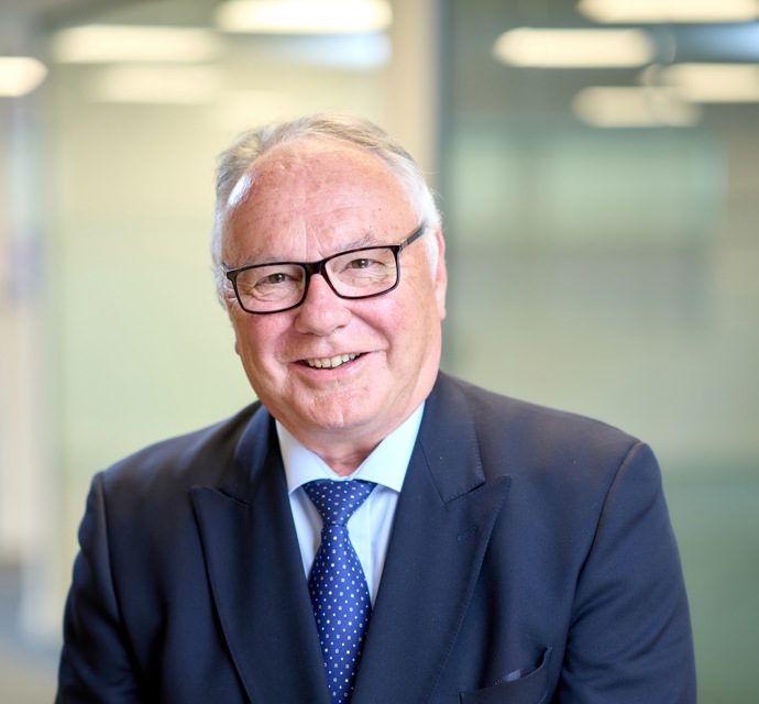 Head and shoulders photograph of a Bromford board member in an office